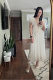 I bought this dress for my engagement photos. I absolutely LOVE it. It's super classy and chic. The length is perfect. Reached just above my ankles. For reference, I am 5'7" and 160 lbs. I usually wear a M/L. I was debating whether or not to get a L. So glad I went with a M. Its super comfortable. Keep in mind, you will have to use fabric tape to hold up the sleeves. It's also a bit see through, so do with that what you will. I could not recommend this more!! Definitely need this for your bridal look(s), Bach party, summer, honeymoon, anything!! It's so versatile! - Carolina O.