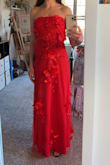 Absolutely love this dress and the color. I am wearing it for my senior prom and couldn't be happier with it, especially buying it online but it fits great. I did order a small just because it's strapless I wanted to make sure it would stay up and it does! It's a little big around my waist for my liking but the little space makes it comfortable. The zipper in the back is covered and hidden by the flowers -which are so cute and lay very nicely. (I couldn't zip it up all the way by myself because my arms don't bend like that but it is able to zip all the way!!!) - Gracie S.