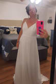 I am still looking at options but I love this dress. Keeping it for my wedding. It has weight to it and is great quality. The front is very simple but the back is just gorgeous. It is long, but I am only 5 feet 1 so that is to be expected. Beautiful if you are looking for a simple, elegant, comfortable wedding dress. - Kayla E.