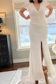 I was pleasantly surprised by how much I liked this dress!! It fit very nicely and I loved the sleeves and open back. My only issue was the slit being right in the center. I stepped on the stool and was immediately concerned that I was about to flash everyone in front of me. But the style exists, so it must work for some people! Just not for me. I prefer the slits on the side. :) - Christiane L.