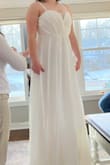 This was a very pretty dress. I liked how the fabric was gathered on the bodice! The overall consensus though was that it felt and looked more like a bridesmaid dress. Also, for those wanting to know what size to get, I should have tried on a medium, since this did not zip. - Christiane L.