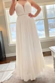 This dress was very pretty with a classic Hollywood feel to it! I definitely should have tried on a 6, as this was only just able to be zipped. The laced open back is fun and sexy, too! Ultimately, it didn't fit the vibe of my wedding and venue, but it is a very nice dress! - Christiane L.