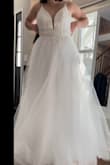 This dress was beautiful and fun!! I loved the plunging neckline and the double straps. It was just a bit too poofy for my taste! Otherwise, the quality, beading, etc., are great! A 6 would have fit better, but I imagine it would have run a bit small! - Christiane L.