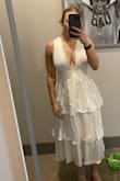 Very fun and flattering. Not any stretch to it so be sure to get true size. Can't wait to wear to my rehearsal dinner! - Alexandra P.