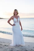 Fits true to size
Fits body shape & curves perfectly 
Very giving as you can tighten the back ropes as tight or loose as you wish
This dress does not need a bra
It is just as beautiful in person, as it shows in the pictures.
It was the PERFECT beach wedding dress I was looking for.
You can even hand wash out the bottom of the dress & line dry, if it's gets water and sand on it.
I HIGHLY RECOMMEND THIS DRESS !!! - Theresa W.