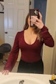 Very comfortable and soft- I love this top. I'm usually a small so I ordered a small. Slightly tight in the length/torso. Fit nicely elsewhere. 

If you have a long torso I'd size up. I have a short torso but the top still pulled down tight so my cleavage was very out. My chest isn't that big and I kept having to pull the shirt up so my cleavage wasn't completely out. 

Still very happy with this top and have it in 3 colors :) If you don't like low-cut tops on your cleavage, I wouldn't recommend or size up. - Kaitlyn L.