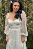 I was a tad apprehensive to order this since there were no photo reviews, but I'm so happy I did! I wore this for my courthouse wedding and it had the perfect flow to it! I ordered a small and felt as if I could have sized down, the only reason why I didn't was because I didn't want to wait for shipping on it! If you're in between sizes and have a smaller bust, I'd size down so it hugs your chest properly. - Isabel M.