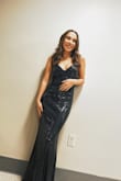 The dress was gorgeous. Ran a bit large though! If you are short you def are gonna have to wear tall heels or cut it hemmed a bit. Overall amazing dress though! - Skylar M.