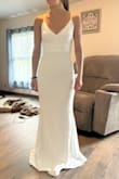 This dress is stretchy and is a nice thick material. It's really a great value and this is the dress I'm choosing for our wedding. I think I'm going to alter the back to be a V shape and add a little lace at the waist and maybe trim the back with lace too. It's such a good price I can alter it the way I want it and I've still spent wayyy less money than most people on a dress I'm only wearing once. - Delanie S.