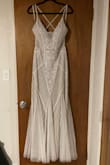Chose this for my beach wedding ceremony. Mermaid vibes and is going to sparkle so pretty by the water. I may fix the straps to be straight Instead of crisscrossed, and add a bit of fabric to create a slight train, but other than that it's perfect. - Monik L.