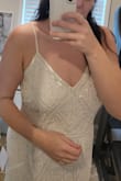If taller than 5'6 or bigger than 36c this won't fit you it's so heavy w the beads. Buy a backup for sure. My measurements and weight are correct - Claire M.