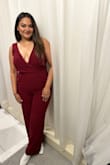 The zip was stuck for a minute but once it was on- the dress fit comfortably. Fabric is stretchy. - Gayathri I.