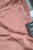 Item fit small and material is snags I'm varies locations. - Adela G.