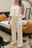 I bought this as a potential second outfit to change into at my wedding reception. The price was too good to be true so I assumed it would look/feel cheap when it arrived. I was so blown away in the best way when it arrived and I tried it on. The material is thick and has a good weight to it, definitely not cheap or sheer! The fit was absolutely perfect which was a relief because I am usually in between sizes, but the small fit like a glove. I have long legs and was happy that the length is enough to wear I can still wear heels. It is so comfy and I didn't want to take it off once I tried it on. I tried on similar outfits from wedding retailers for 5x the price and this jumpsuit by far was the most flattering and comfortable choice. I can't recommend enough!! - Kara H.