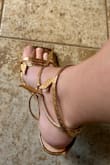 Beautiful shoes, but the wrap around strap with the buckle is too long. I got a 8.5 in green and a 9 in the gold and both straps are too long to fit around my ankles, plus theres a big gap on the lower section that connects to the wrap around strap. There's over an inch of a gap even on the tightest buckle. I would have to puncture my own hole but even then I would have to cut off one of the leaves to do it. Maybe someone else could make them work, unfortunately I could not. Still beautiful though! - Holly K.