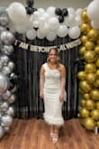 Wore this for my bach party! True to size and really comfortable. There is a rubber strap all around the top so it doesn't move around on you. Got so many compliments. - Lea W.
