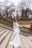 The wedding dress is simple, elegant, and beautiful. It came a little wrinkly, which is expected due to the fabric and transportation, but after ironing it was perfect. Even after wearing it all day was stunning. - Ingrid S.