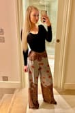 I love these pants! I read the reviews and every one said to size down. I'm usually a medium in pants but went with the small and I'm so glad I did. They fit perfectly! Small clasp and side zipper closure. Beautiful statement piece. - Amanda D.