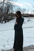 I used this dress for my maternity pictures and it was great! The green is so beautiful and the material is so soft, it also has some stretch & flow at the bottom which is always a plus! I ordered a medium and am currently 158 lbs and thought the fit was just right! - Abby T.