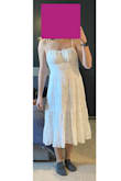 It fits wonderfully! Very Very pretty dress. I want it in every color lol, but I got the white one for my welcome event on my wedding weekend. - Elizabeth C.