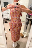 This was straight out of the package and I didn't tighten the straps on the top so I could have done a little more to help it. But this was awful! I normally wear a small and that's what I ordered but the bottom wouldn't even stay up and it was very awkwardly long and thick. The material was very beautiful though so I will give it that! - Avery J.