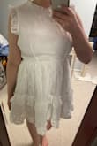 I love this dress! It zipped up with no problem my first time trying it on, but when I tried it on again to show my mom & fiancé we couldn't get the zipper past the waist seam. Not sure if I'll return it bc it zips fine off of me and I'm trying to lose weight so maybe after a few pounds it will zip easily. I am right in between M and L on the fit finder. - Annemarie R.