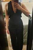 I really wanted to like this jumpsuit. The material is stretchy, soft, and comfortable, but the fit is just awful. There is no zipper, so I had to very carefully pull it over my bottom because I was afraid it would rip. It looked so tight and unflattering on my hips. Then I had to awkwardly bend my head to get it through the straps one by one. There was so much extra fabric on the bust/straps that it was gaping on the sides. There was no way I could adjust the straps to fix this. And on top of that, the crotch was absurdly low. Maybe this fits someone with a longer torso and bigger bust. I often wear jumpsuits and rompers and never had sizing issues, so this was just wild. There is no way sizing up or down would solve this. Honestly, I'm ok with this jumpsuit not working out because going to the bathroom would have been a nightmare. I'm glad this looks super cute in other people's review photos, but just beware this jumpsuit is not universally flattering. - Juliet T.