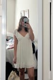 Love this dress a lot. Ordered a S and XS and kept the XS just because the Small gapped a little bit in the chest! The size down had about a half inch shorter in length. Chose it for graduation because it is definitely not a wrinkly fabric and will be nice and cool in the hot weather. - Katherine L.