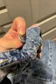 This Jean jacket is beautiful! It hits just right. I usually would size up just to get a good fit because of my arms filling up every long sleeve I own- I sized up to a medium and I have a comfortable amount of space in here. However, I just received this jacket and after the first wash, the bottom on the back strap popped off when I took it out of the washer.. so disappointed in that and expect a better quality for the price. - Melissa P.