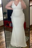 The dress fits like a glove! The material is stretchy and comfortable. The straps were not adjustable like i thought, didn't bother me that. - Isabella F.