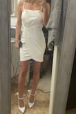 Material is thick, but also perfectly stretchy. I have a little bit of gapping in the small of my back but otherwise, it fits perfectly. Purchased for my bridal shower 
(Photo is straight out of the bag, I need to steam it) - Amber T.
