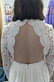 The dress was pretty but I think I should've ordered a small instead of a medium. The part that went towards my back was loose. The top in general was a little loose. - Sarah K.
