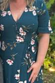 Loooovvveeee this dress! Finally a wrap dress for a large bust! I did have to pin the too because the button would bust at a moment's notice. It was windy so I pinned a the slit.
I am 5'4" and with some block heels the length worked fine but if I would have had more time before the event I would have had it hemmed. - Stefanie J.