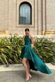 This dress is truly so beautiful. It's the most glamorous and flattering dress ever. The material is thick and not overly shiny (it has gloss but doesn't look cheap). The cut and designs is literally just *chef's kiss.* and it has pockets! I wore it to a fancy wedding and felt like a celebrity. The only criticism I have is that the straps are adjustable, which I think cheapens the look, but I had an "alterations specialist" (my mom!) remove them and sew the straps to my custom length which I think really elevated the look. 
I will never look better than I did wearing this dress. If only it could have been my own wedding dress!! - Silvia S.
