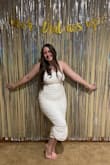 I wore this dress for my bachelorette party and it was so comfortable! I don't normally go for a fitted dress but the ruching and pearls fit well on my hourglass figure. I received so many compliments and may even use it for my second reception dress at my wedding! The material was soft and stretchy and made it even more comfortable. 11/10 recommend! - Erin K.