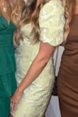 I am 3 months postpartum It took me forever to find a dress that wasn't totally clinging to my stomach area! The mom pooch is real IFYKYK!! This dress fit a little big on my top part but with some safety pins, it was perfect! The color was beautiful for a spring wedding! - Kami H.