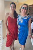 This dress was perfect for a beach wedding! I ordered up and was happy I did as it fits great. I was able to wear a strapless bra with no problems. I loved that the straps were adjustable. The added fabric in the front was really flattering. The material wasn't too hot and I got so many compliments! My only complaint is that the slit is quite high and in the wind will blow open. I ended up holding the dress at the slit as it was a windy day. Otherwise, this dress was a dream! - Janine M.