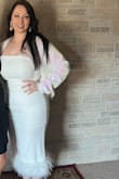 I bought this dress with no reviews and I am SO glad I did! I was worried it would look "extra" or over-the-top but I figured I would try it out. I loved this dress. I wore it for my bachelorette party this past weekend and I got a lot of compliments on the dress. It photographs very well, I was surprised. White can be a very unflattering color on me and after seeing the photos, I loved the dress even more. The fit was overall true to size but it was a little tight in the hips so I had to adjust it correctly to the feathers would lay well. I got a L and I wouldn't have been able to go up or down a size. I think it is just my hips are a little wider than the fit. It still looked great and was comfortable to wear all night. - Jessica S.