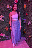 I got this in a size medium although my true size is a small. I had gotten this when I was about 2 months pregnant. The waist has no stretch at all, and the slit is not too high. You can either wear it casually or dress it up. The tie is just for show. Other than that, this is a must-have skirt. You can even wear it during the winter months if you live in CA. - Maiseely T.