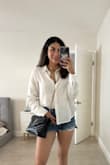 The shirt looks beautiful. It's very summery and adjusts great to my body. I ordered a size S and it fitted really well. - Leidy L.