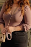 I wore this bodysuit on my honeymoon and let me tell you it did not disappoint. It was so cute, versatile, and extremely comfortable. It worked with the bloat from the heavy meals, snapped back for the long walks, and covered my chest perfectly. I dressed it up, I dressed it down, I wore it a million times. - Cara L.