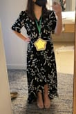 It looks so classy and length-wise is surprisingly good for how short I am. The back slightly drags on the ground if I wear flats but even with a kitten heel, it's good. I had to get the front altered slightly because the v-neck was a bit too low for my comfort. But I altered it so the wrap covers more of my chest and it's perfect. I've worn it to weddings as well as work events. It's my favorite dress in my closet. - Kathy C.
