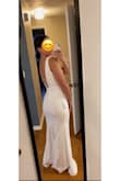 I loved the classic and simplistic look of this dress and the buttons on the back but it did not fit my body type well. I have a smaller waist and larger hips, the medium was too big up top, I ordered a M. - Whitney C.