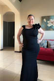 Runs true to size- has a bit strectch. Pretty dress. - Maria C.
