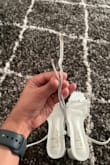 Since one of the shoe's straps is longer than the other the fitting is not right in one of the shoes. Because of that, I need to figure out a way to put extra holes. - Varshini B.