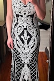 This dress is too long for me but otherwise fits like a glove. And the sequins make for a beautiful dress! Beware, though, I've only tried this dress on and the sequins are already falling off. - Christina W.
