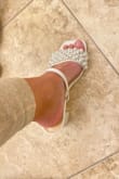 Unfortunately, I had to return. I'm a 5.5 and these felt like a 6. I know I wouldn't last 5mins in these because of the way the jewels and pearls are sewn in& the stitching felt rough and poked into my feet. Two stars for the look. - Melanie G.