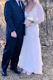 I absolutely love this dress! I bought it last minute with no time for alterations. So happy that it fit perfectly! I bought a rhinestone clip for the train. I forgot to remove it before the pictures :( I got a lot of compliments. It was an amazing day! - Holly G.