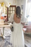 This dress was so perfect for my bridal tea. The front part wraps around so you can adjust the coverage in the front. - Kaitlin C.