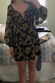 This dress was not flattering on me. I have a very small bust, and I felt that the low v-neck cut of the dress amplified the fact that I have no cleavage. I ultimately returned this dress. - Karilynn C.